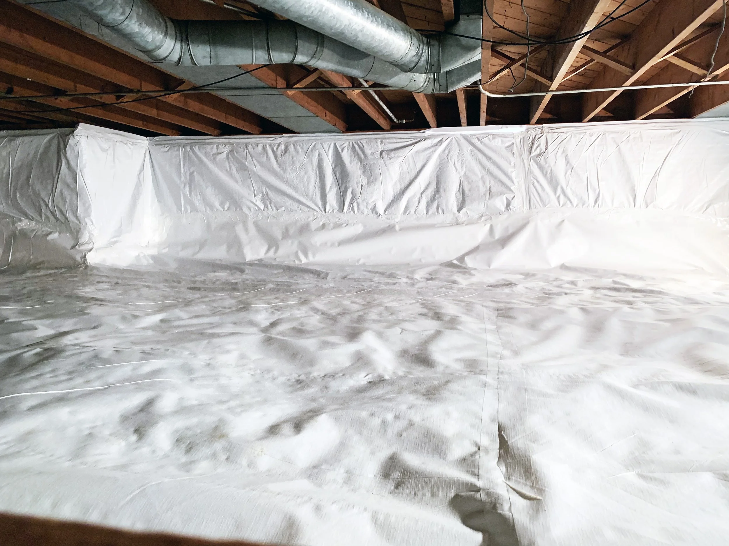 Insul-Barrier insulated vapor barrier installed on a crawlspace foundation wall